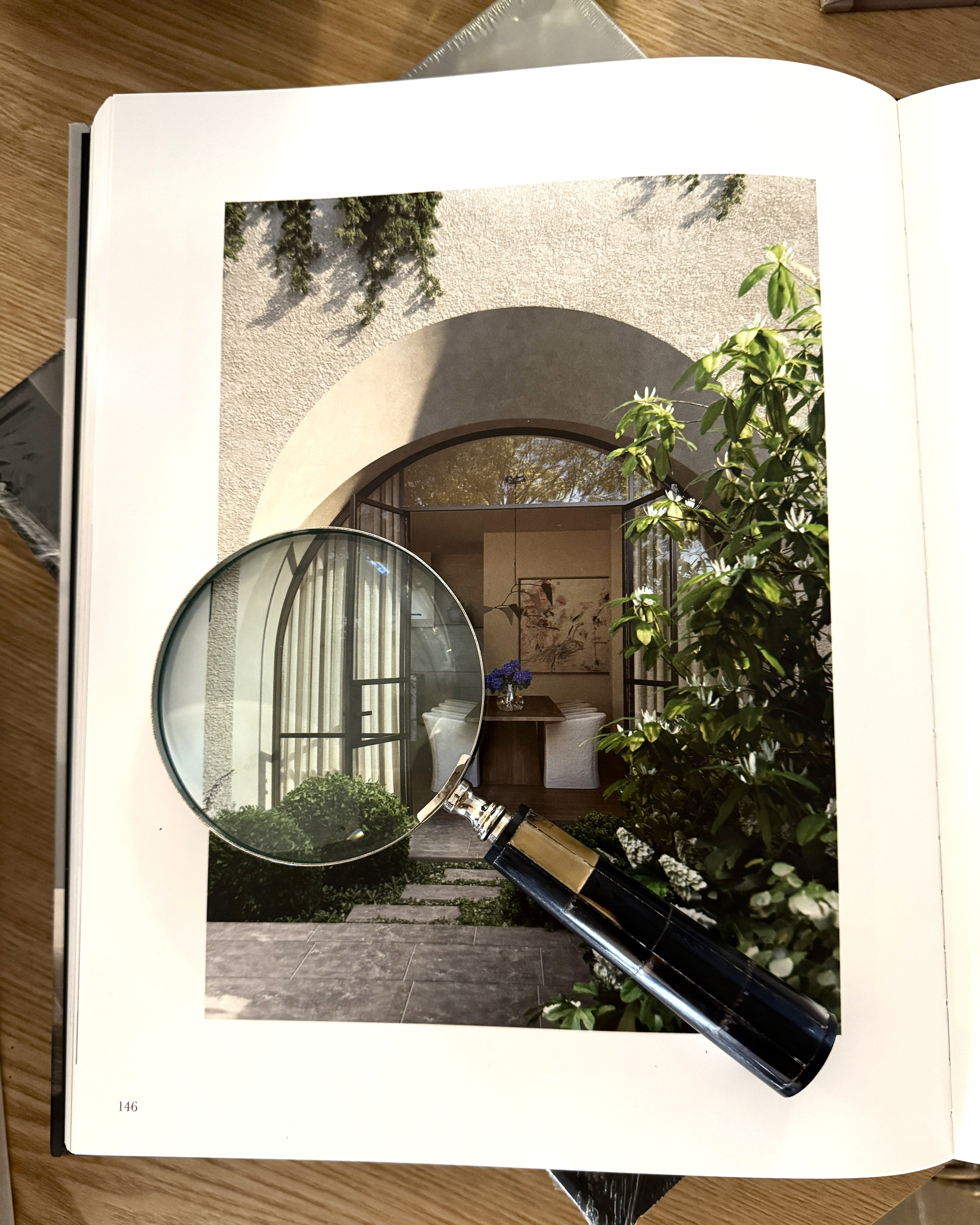 Decor magnifying glass with horn and nickel finish, featuring a vintage-inspired design for stylish home decor.