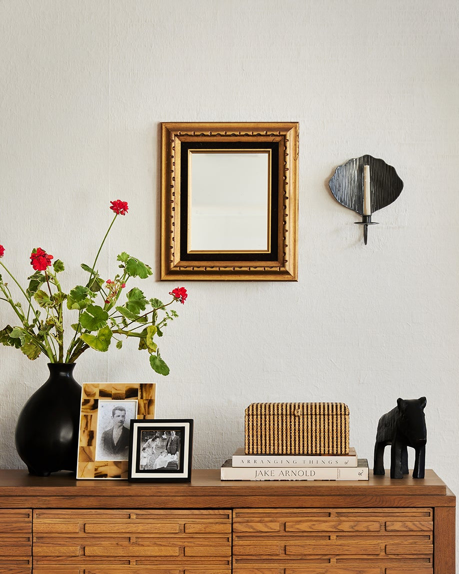 Wooden cabinet with decorative items in a room setting