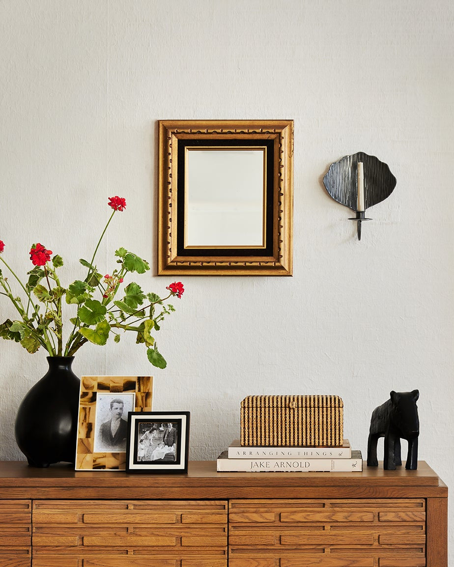 Wooden cabinet with decorative items in a room setting