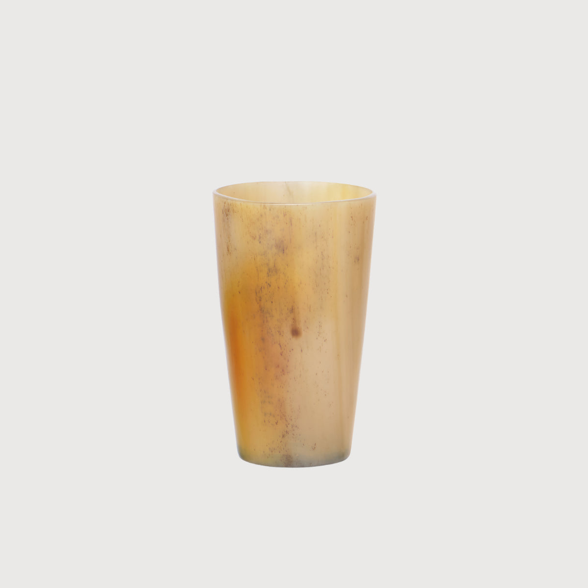 Amber Horn Vessel container by KATE NIXON HOME, featuring a warm amber horn design with a smooth, rounded shape.
