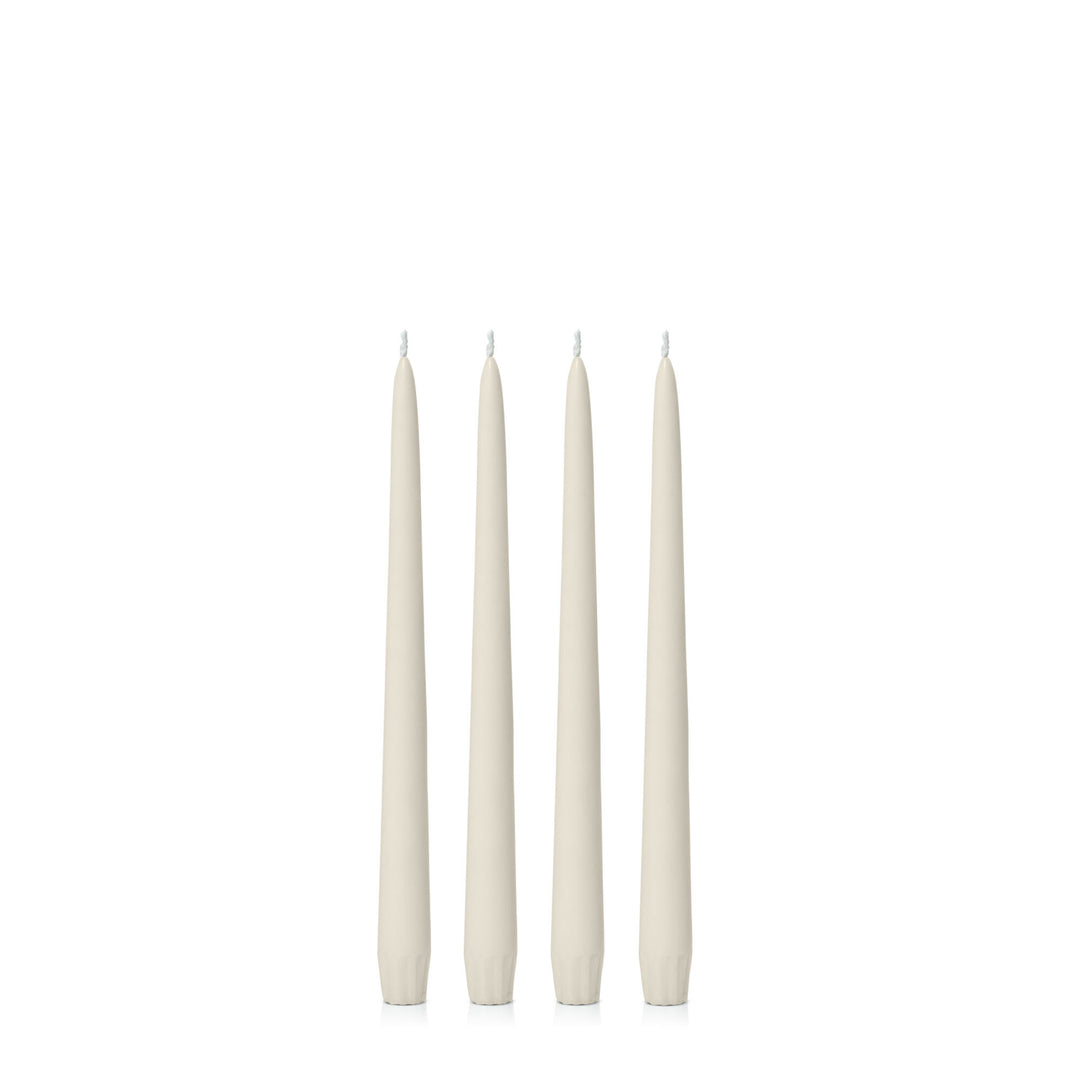 Set of four ivory 25cm taper candles from Hueseeka, designed for room fragrance and decorative use.