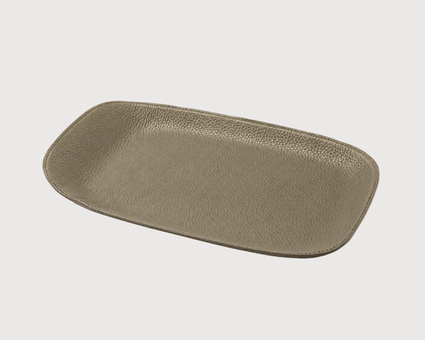 Beige ceramic serving tray on a black background