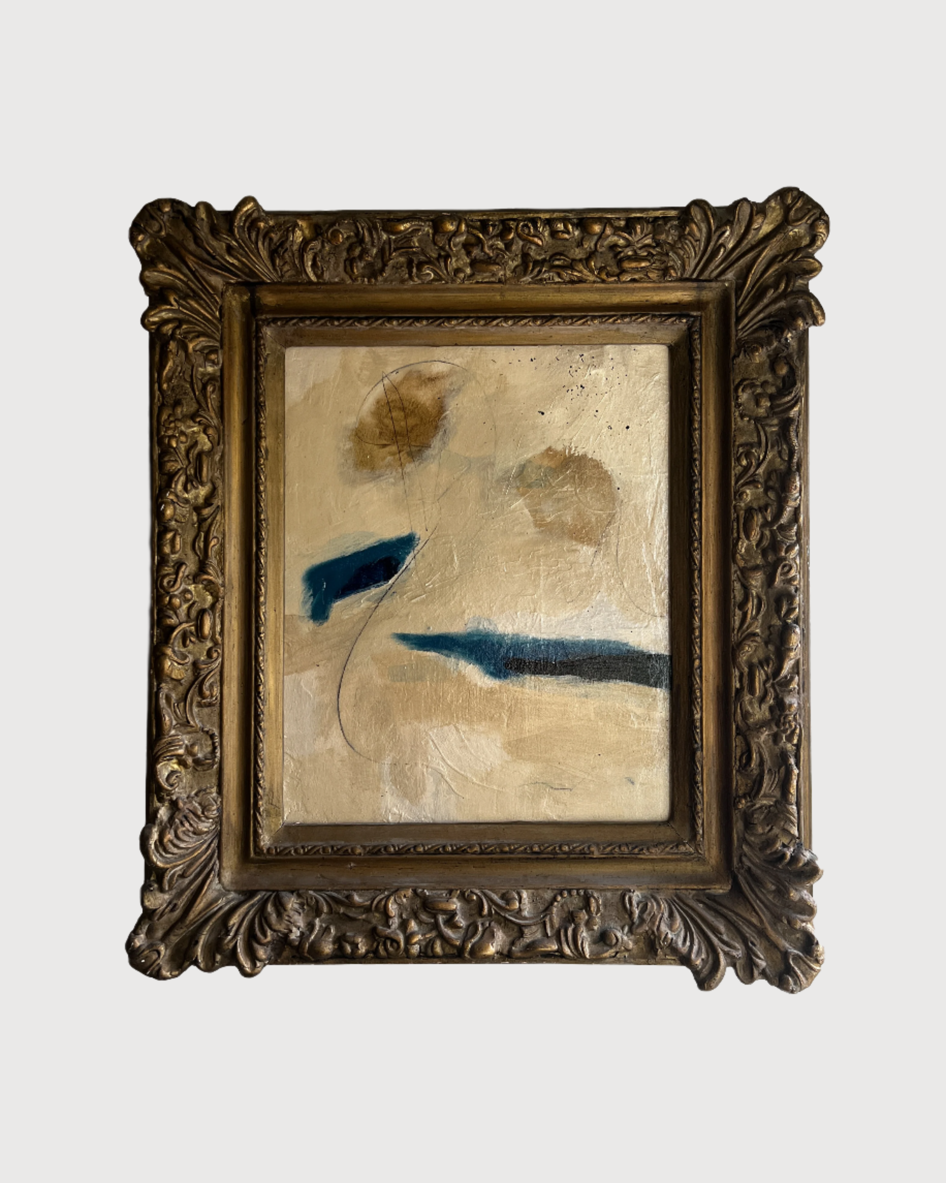 Decorative antique framed artwork with abstract design on a white background