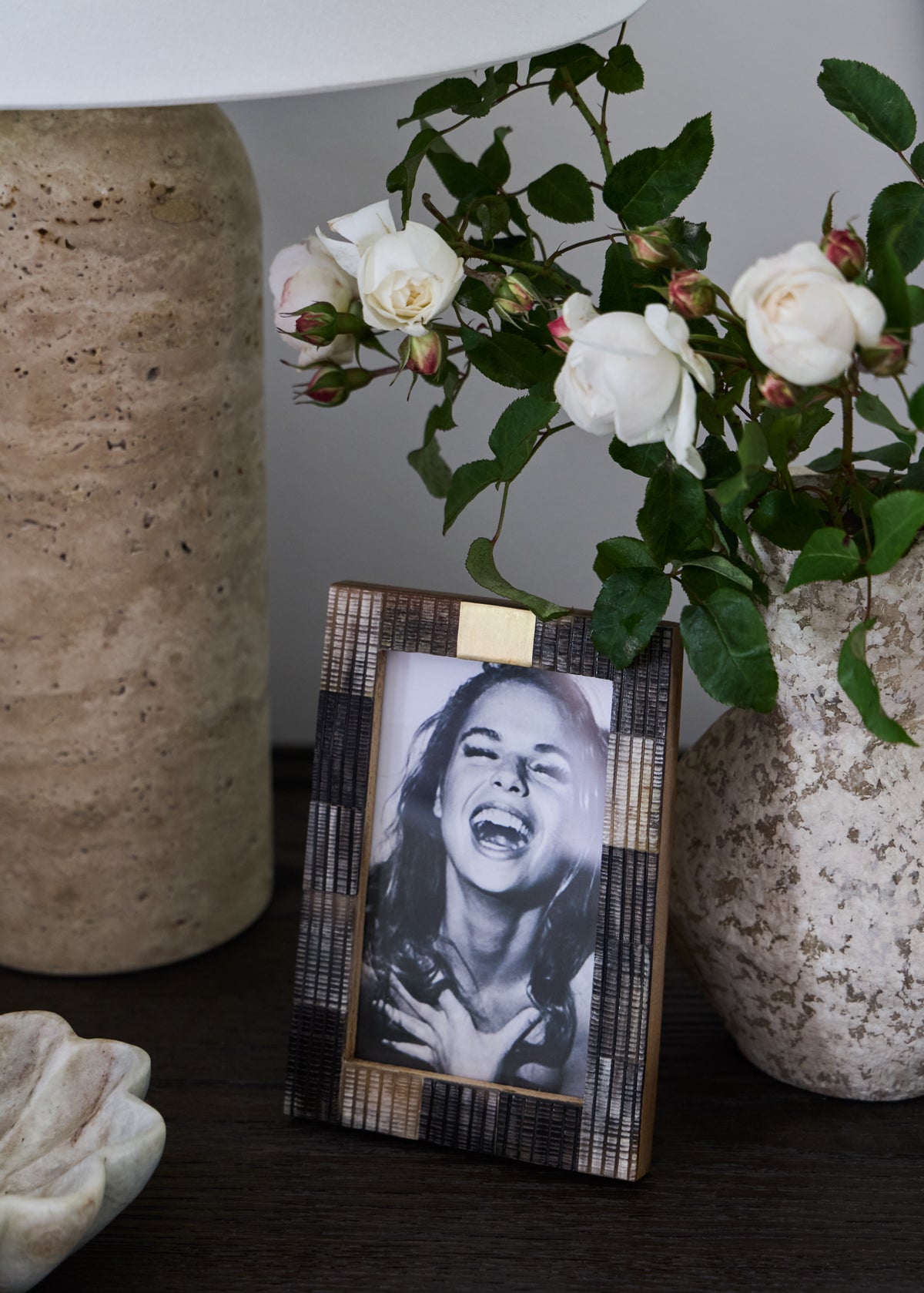 KATE NIXON HOME Renn 4x6 photo frame displaying a family picture against a wooden background.