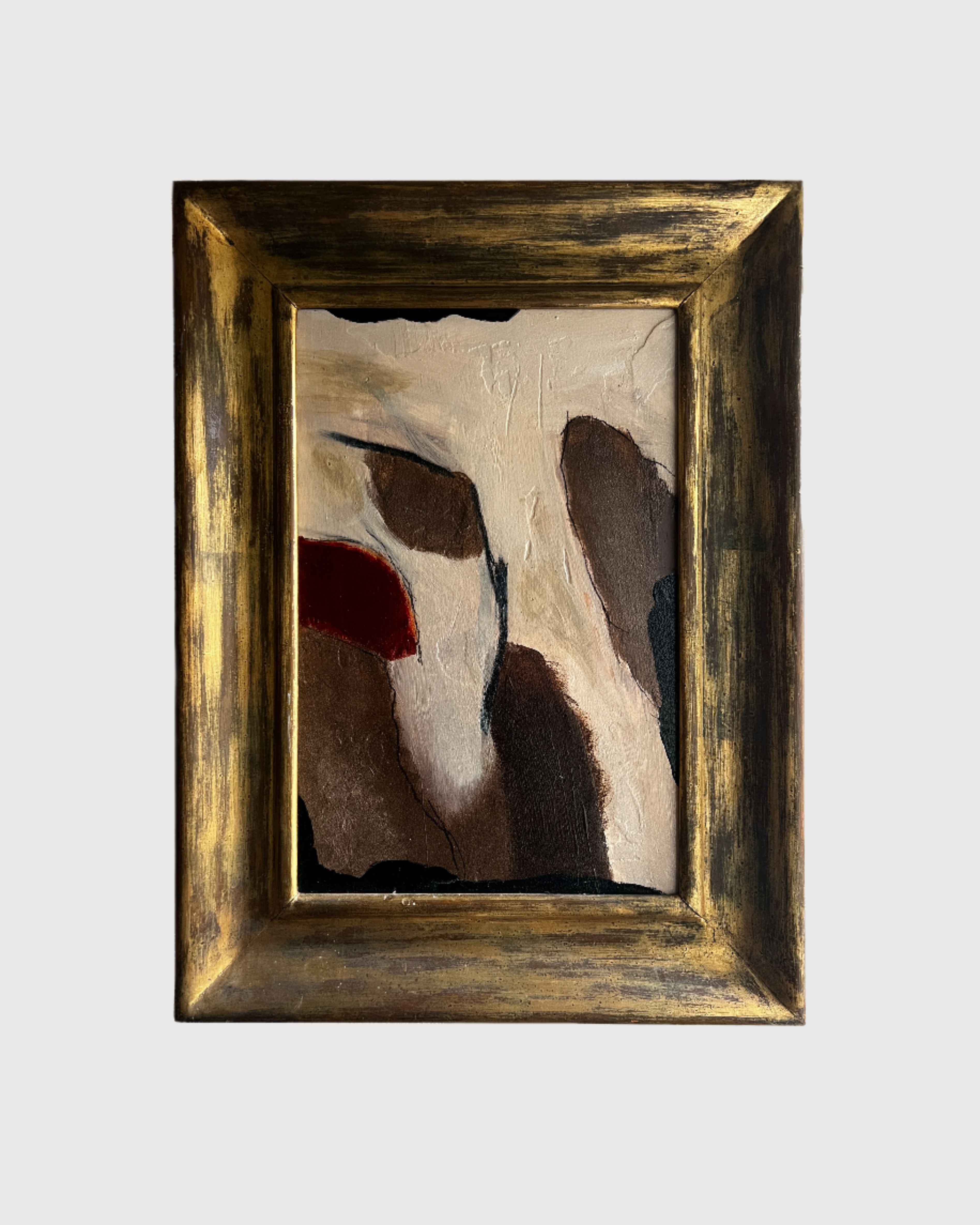 Abstract painting in a gold frame on a white background