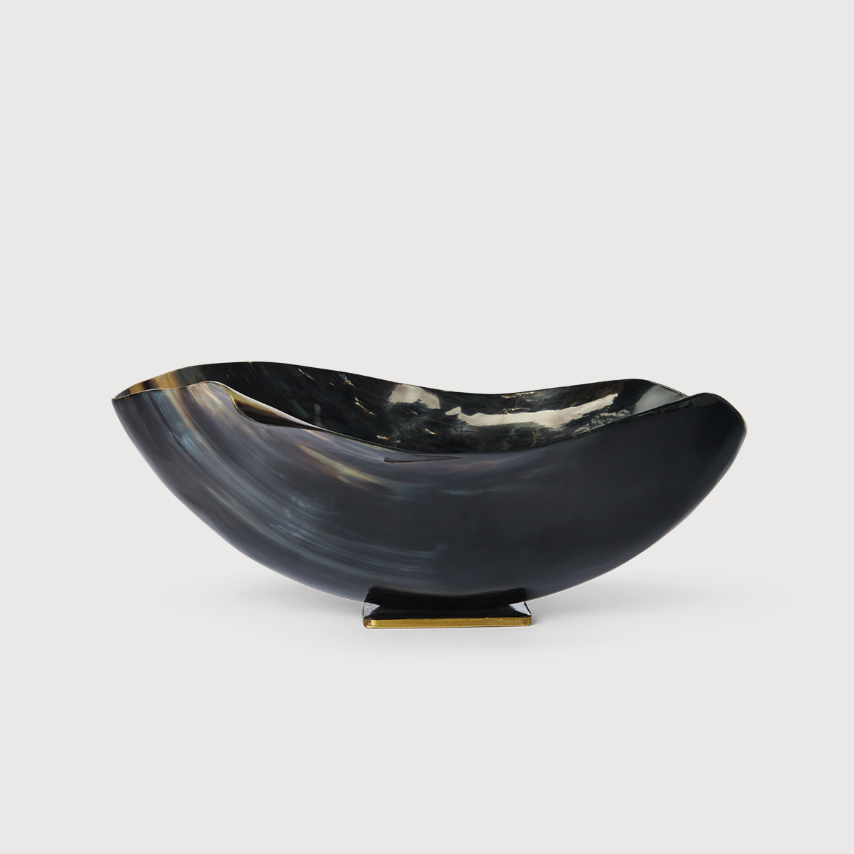 KATE NIXON HOME Patra Horn Bowl featuring a smooth, curved horn design in warm natural tones, perfect for decorative or functional use.