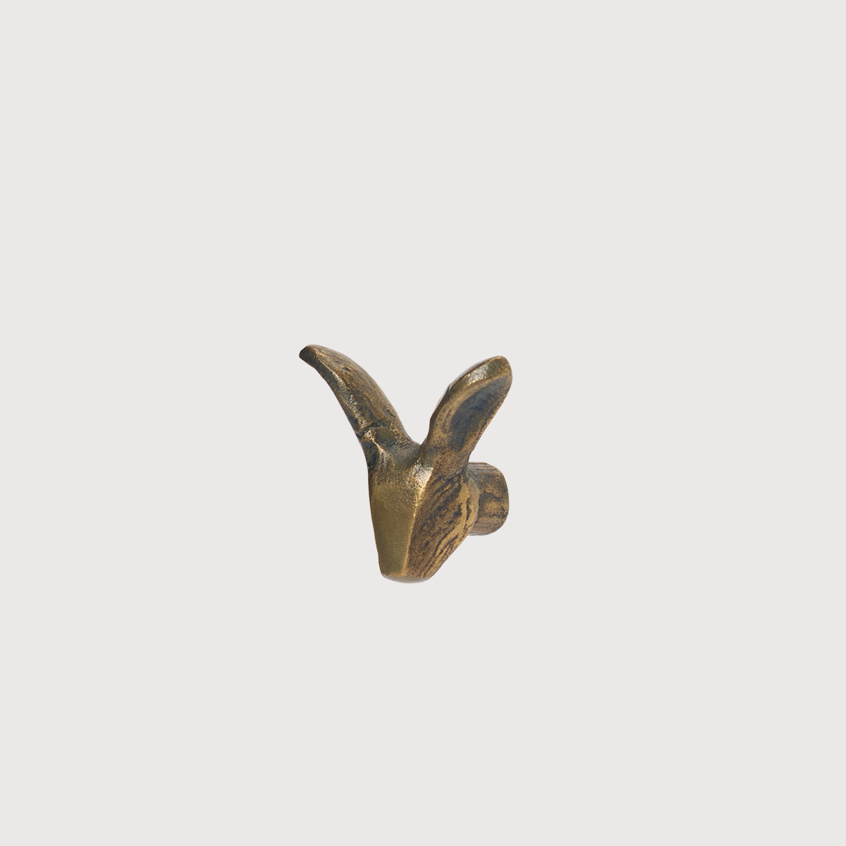 Bronze rabbit-shaped hook from KATE NIXON HOME, a decorative hardware piece for hanging items.
