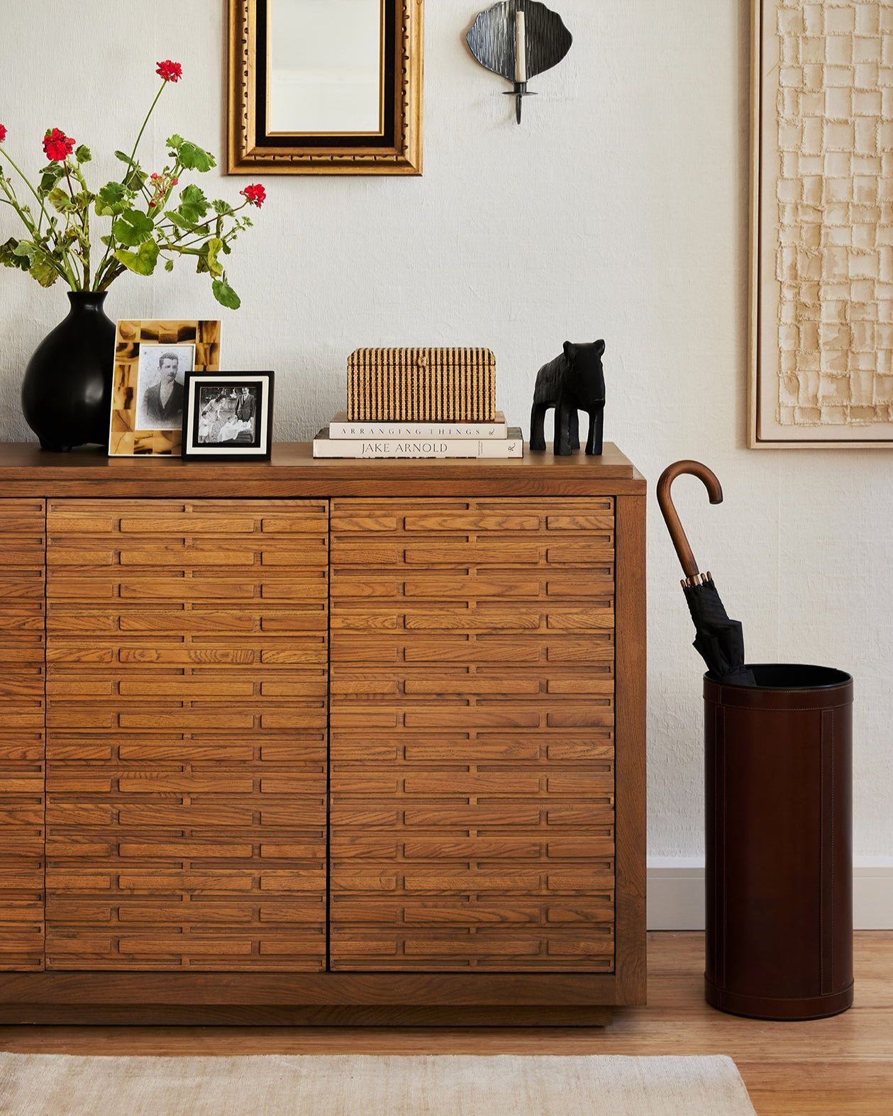 Wooden cabinet with decorative items in a room setting