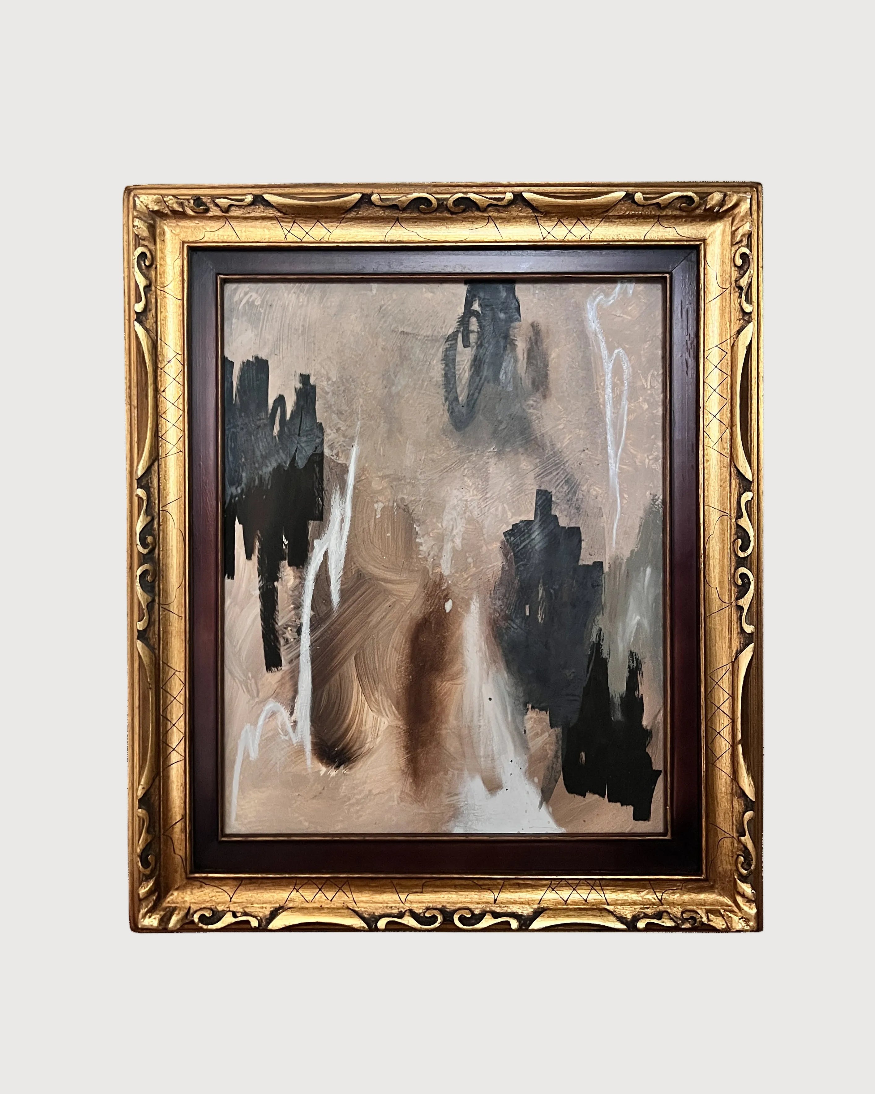 Abstract painting in a decorative gold frame on a white background