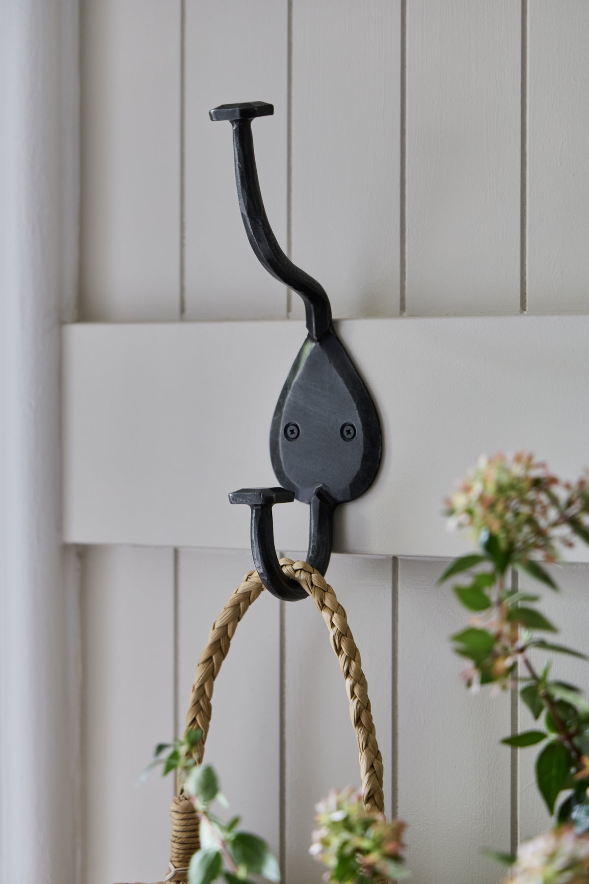 Country coat hook from KATE NIXON HOME, wall-mounted hardware with rustic metal finish, ideal for entryways or bedrooms.