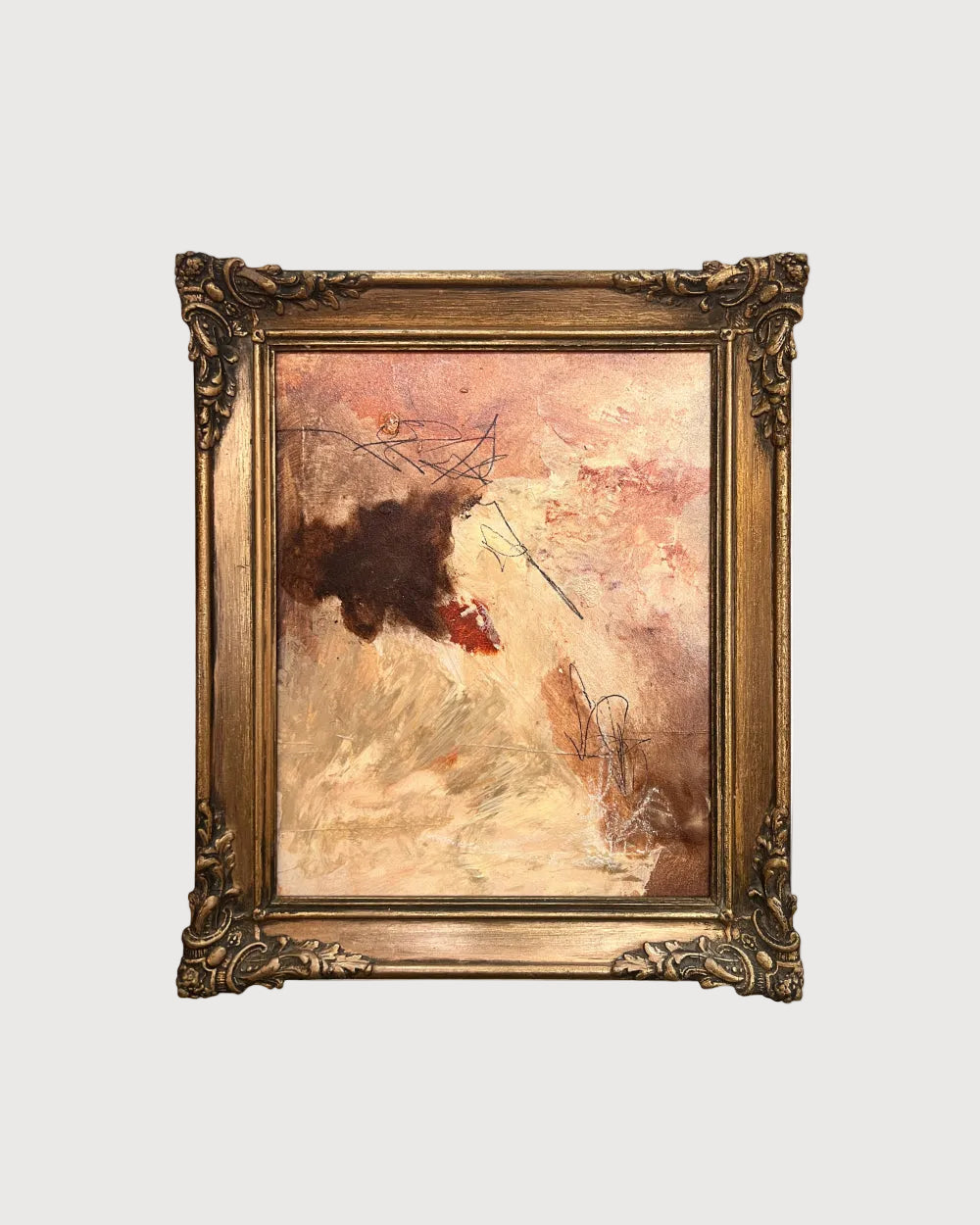 Abstract painting in a gold frame on a white background