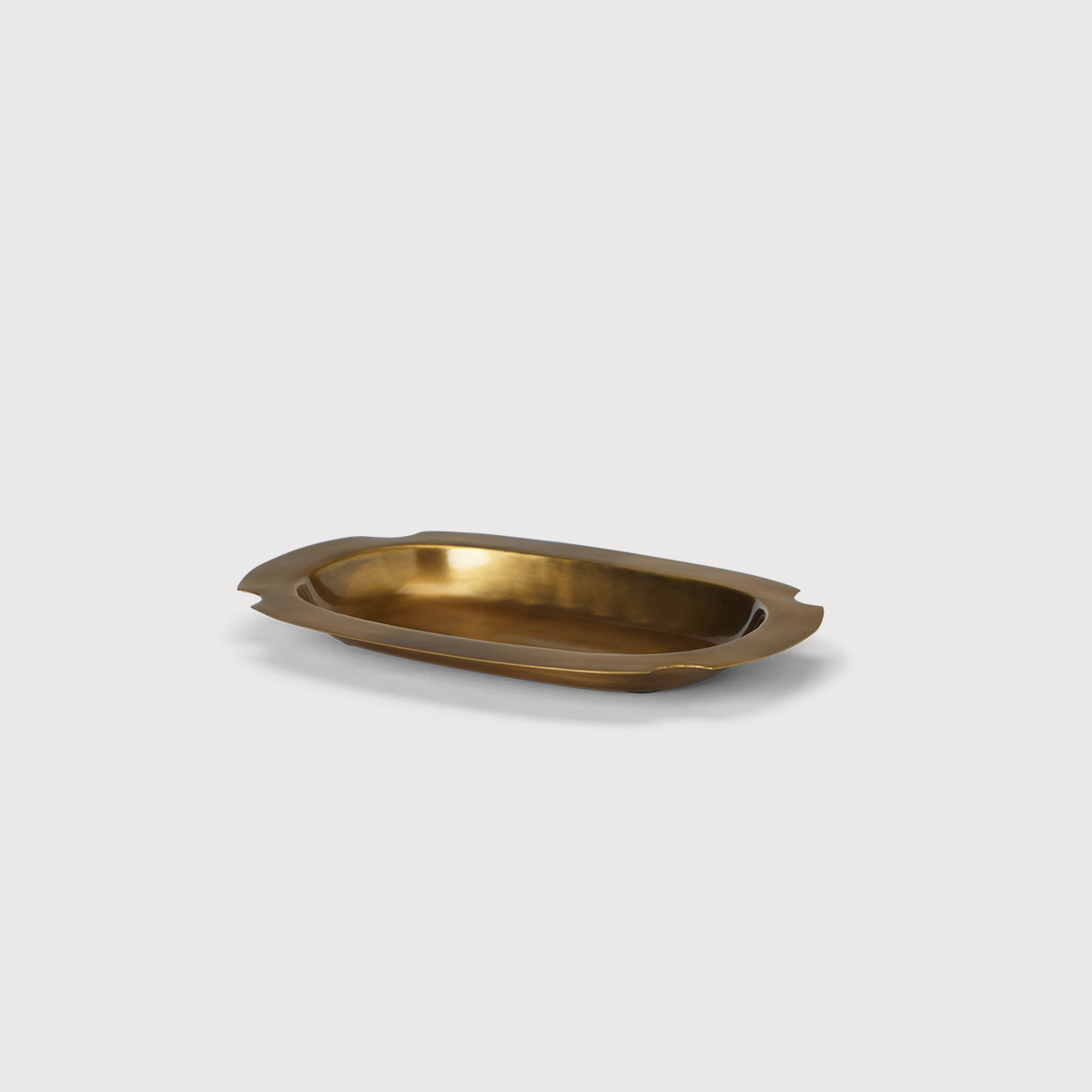 Brass Cade Catchall tray by KATE NIXON HOME, with a sleek, minimalist design perfect for organizing keys and small items.