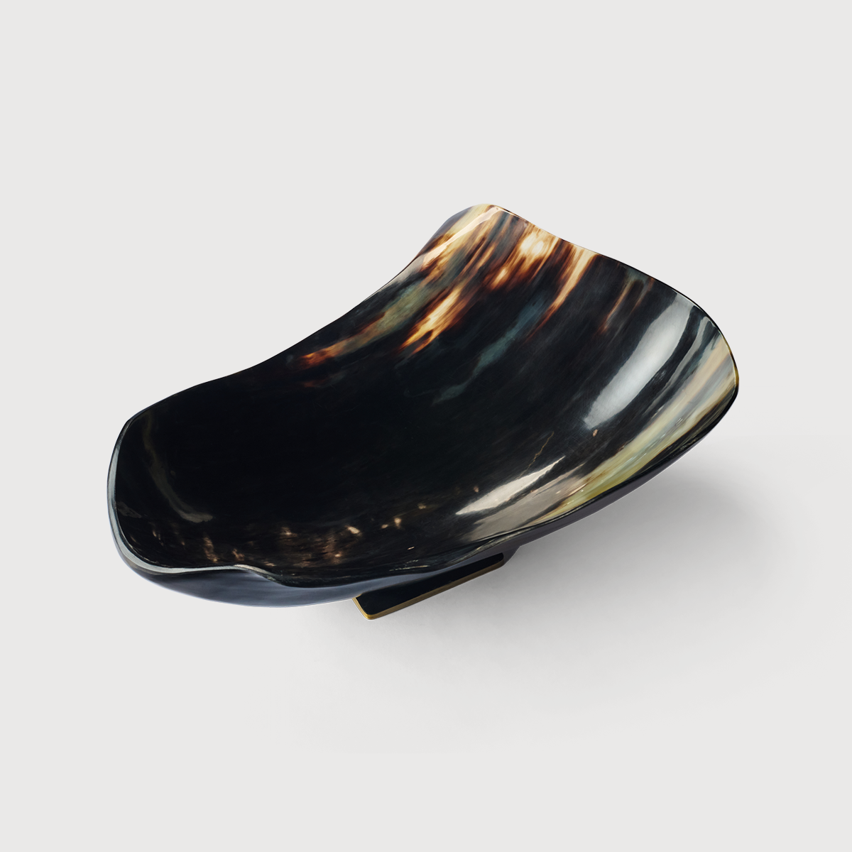 KATE NIXON HOME Patra Horn Bowl featuring a sleek horn design, perfect for stylish home decor or storage.