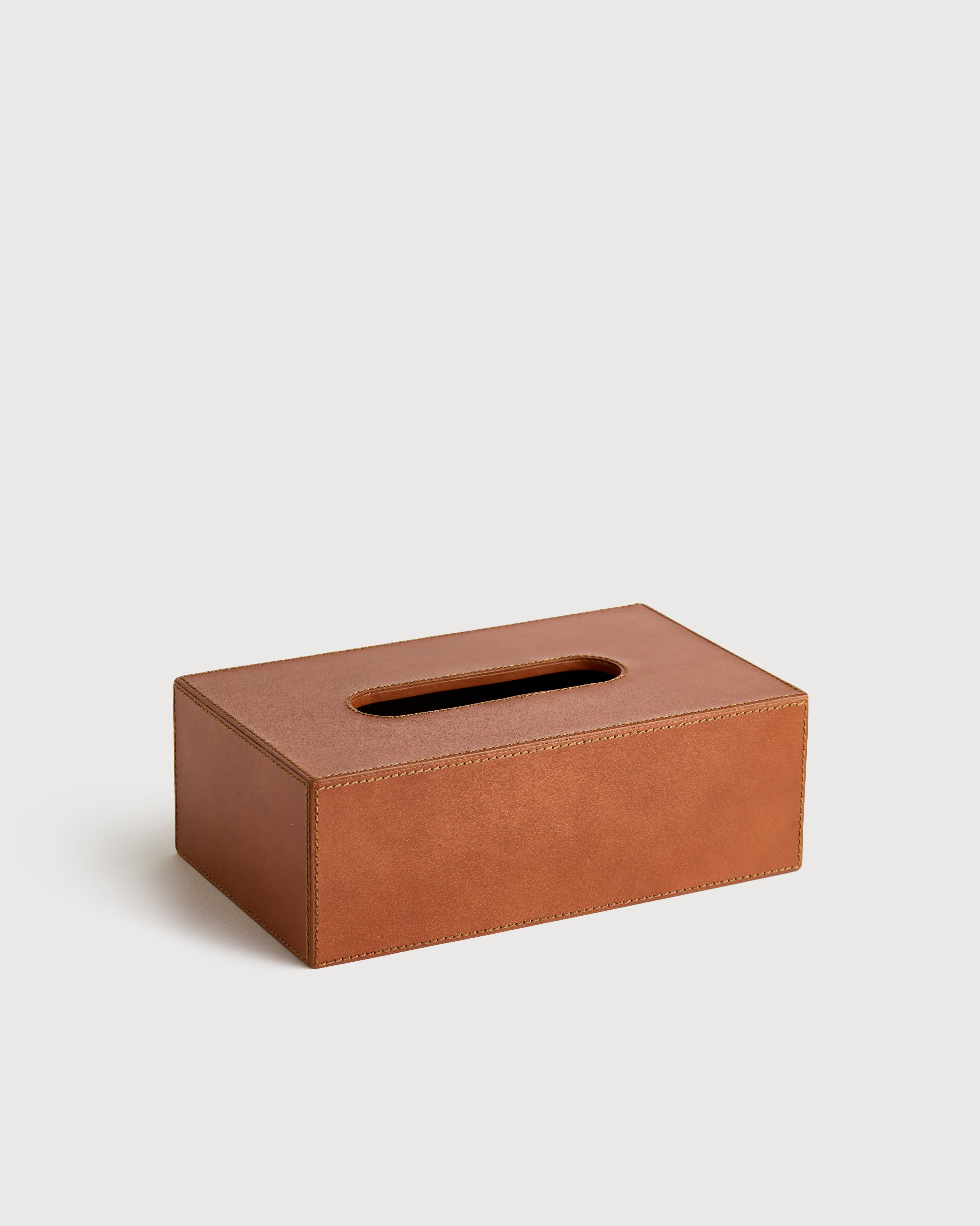 Brown leather tissue box on a light gray background