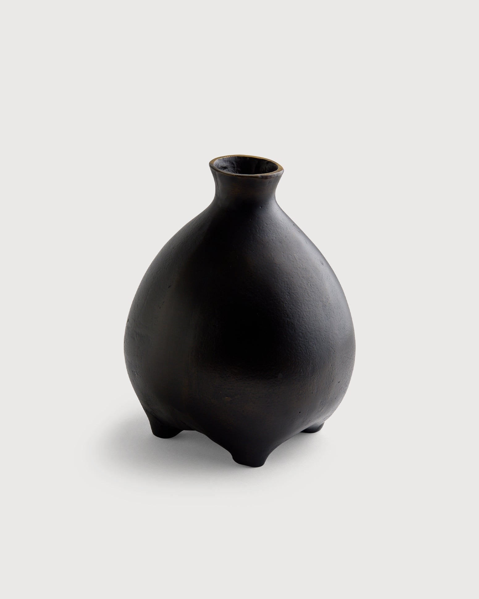 Black vase on a light gray background