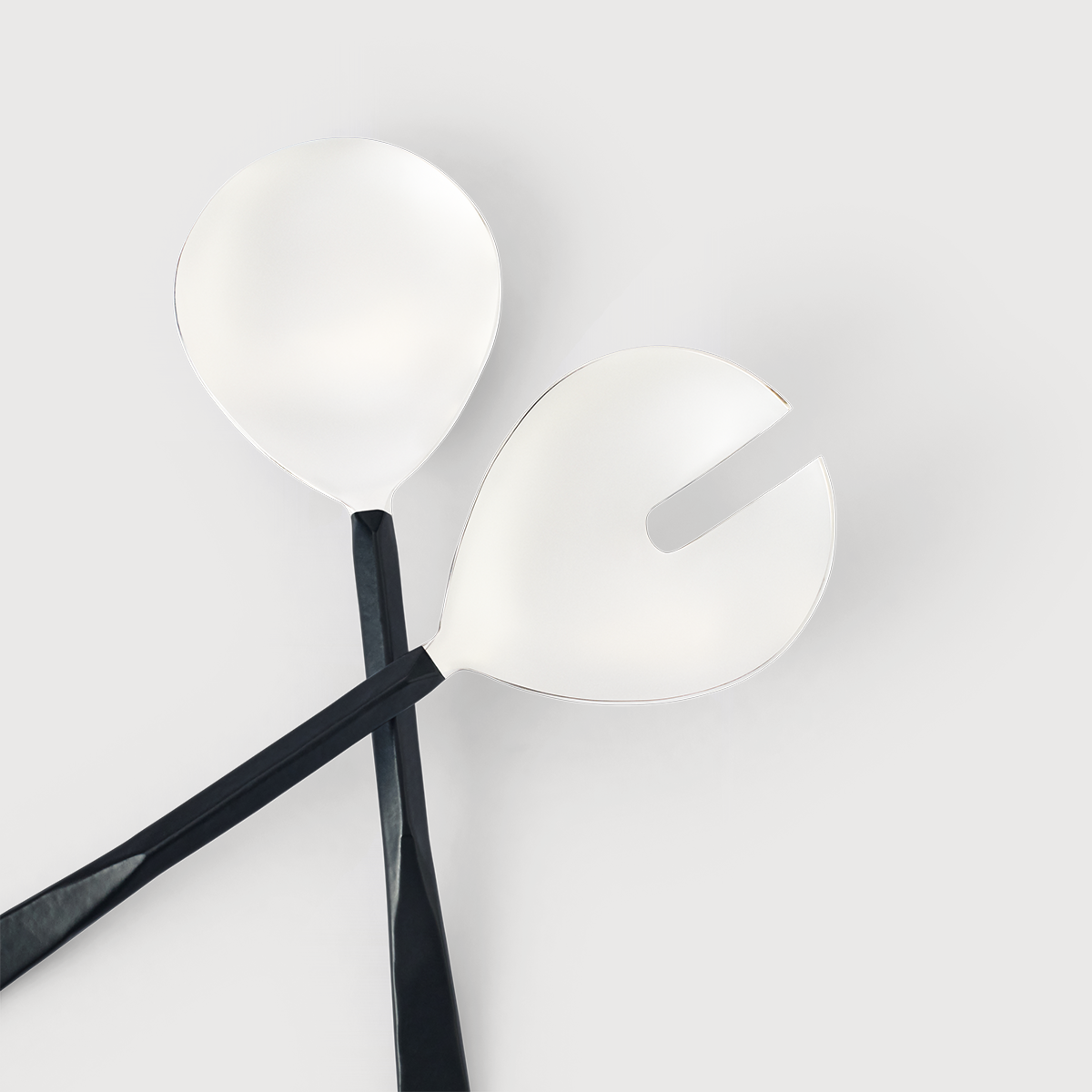 KATE NIXON HOME Valor salad servers, showing a coordinated serving spoon and fork set in a modern design